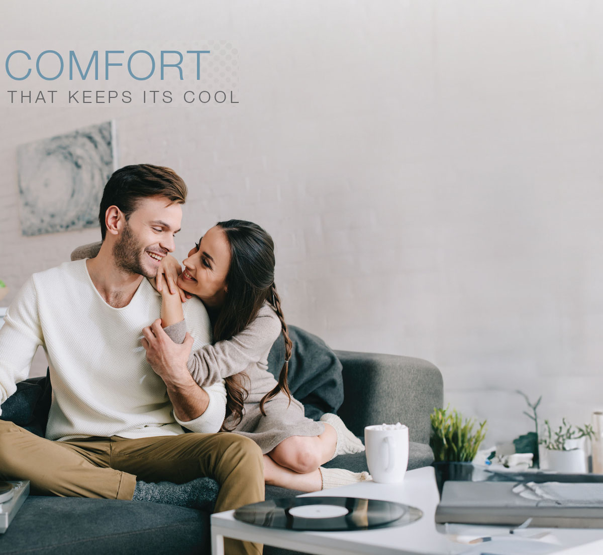 Comfort Keeps Its Cool. Couple enjoying comfort of Rheem RA13NY Endeavor™ Line Classic Series Air Conditioners