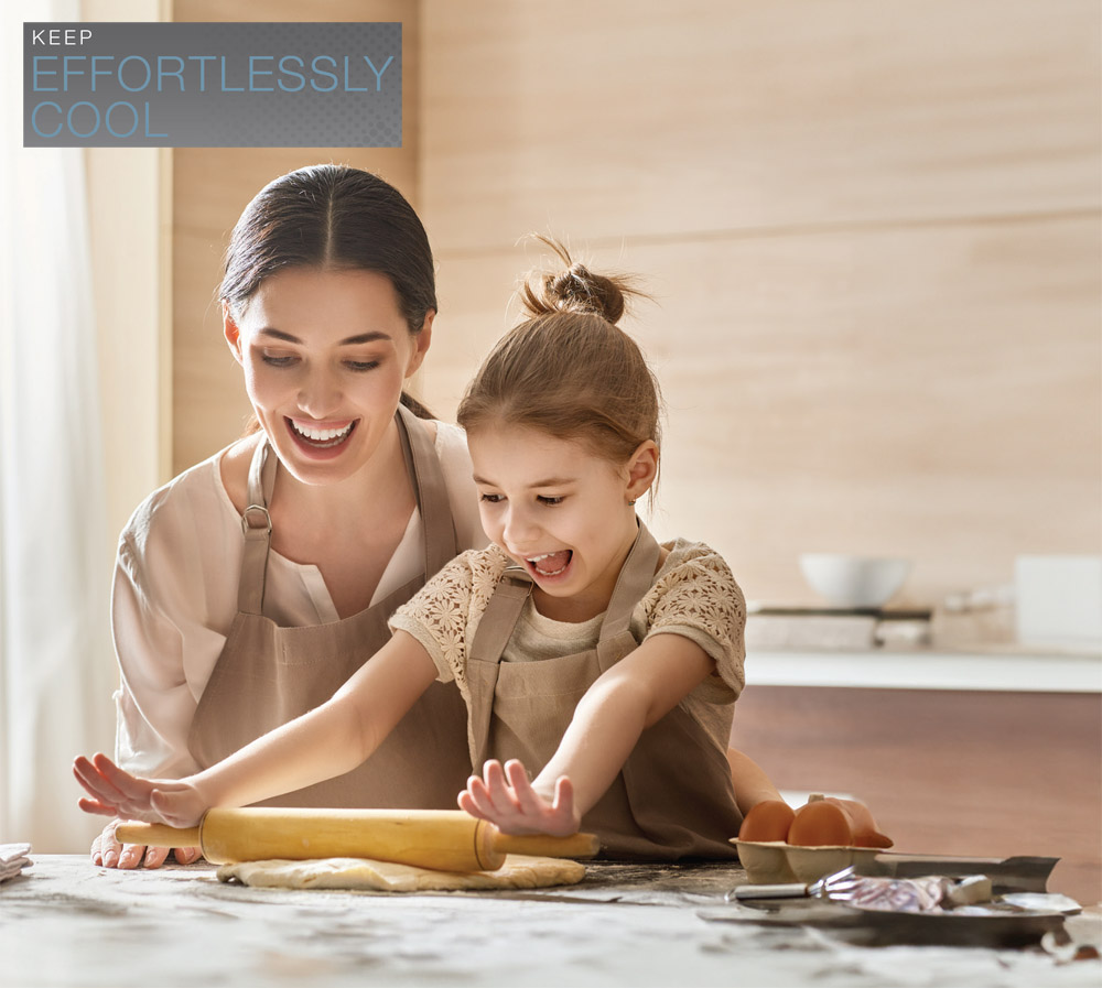 Keep Effortlessly Cool. Mother Daughter enjoying comfort of Rheem RA15AY Endeavor™ Line Classic Plus Series Air Conditioners