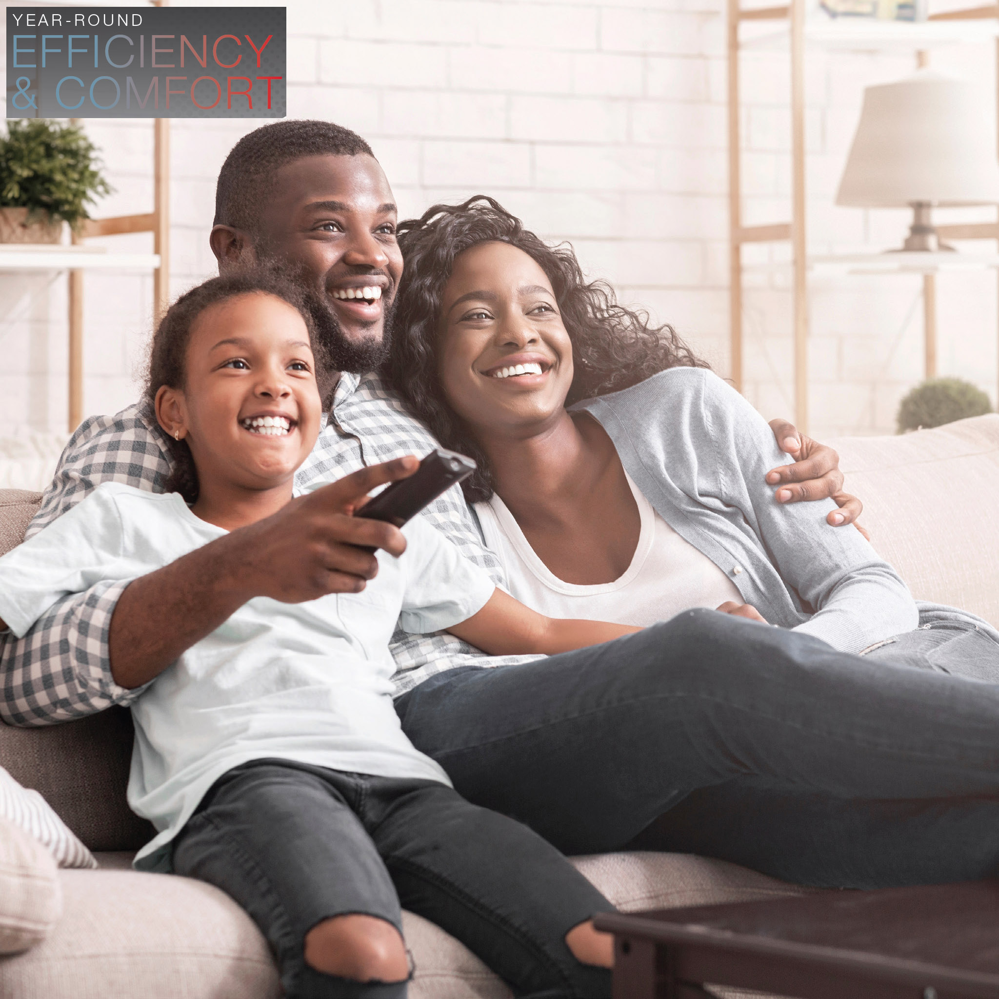 YEAR-ROUND EFFICIENCY & COMFORT. Happy family on couch enjoying comfort of Rheem RP19AY Endeavor™ Line Classic Series Heat Pump